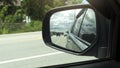 Traveling on the asphaly road. View from the side mirror wing with in the country. Royalty Free Stock Photo
