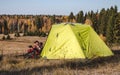 Traveling by bicycle green tent camping background for adventures