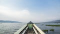 Traveling by boat on Asia lake on an adventure with beautiful sky and clouds in the background Royalty Free Stock Photo