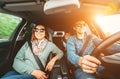 Young traditional family has a long auto journey and Cheerfully singing aloud the favorite song together. Safety riding car concep Royalty Free Stock Photo