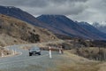 Traveling car driving in road to aoraki - mt.cook national park Royalty Free Stock Photo