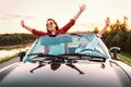 Traveling by car - happy couple in love go by cabriolet car in s Royalty Free Stock Photo
