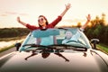 Traveling by car - happy couple in love go by cabriolet car in s