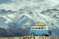 traveling car parking on road side against beautiful snow mountain background Royalty Free Stock Photo