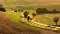 Traveling by car in spring undulating fields of South Moravia