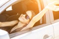 Traveling by car,teenager girl in road trip,summer travel and happy vacation, holidays with friends,woman driver at the wheel in Royalty Free Stock Photo