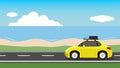 Traveling cars yellow color. Driving on an asphalt road. with roof rack mounted for long-distance tours with a spare tire.