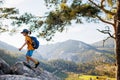 Traveling child. a tourist with a backpack goes along a mountain road. adventure holidays with children