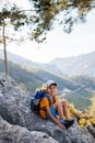 Traveling child. tourist with a backpack is resting on a mountain path. hiking and active healthy lifestyle