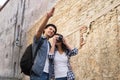 Traveling couple having a walk on bohemian street in Europe