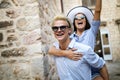 Traveling couple tourists walking around old town. Vacation, summer, holiday, tourism concept Royalty Free Stock Photo