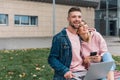 Traveling. Couple Using Laptop, Waiting Transport Near Airport Royalty Free Stock Photo