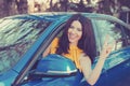 Traveling with fun. Happy woman enjoying road park trip in her new car Royalty Free Stock Photo