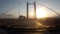 Traveling inside a car in a empty road through a bridge