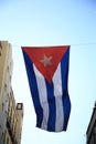 Cuban flag between two buildings against the sky. Agramonte, Old Havana Royalty Free Stock Photo