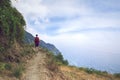 Traveling but keeping distance. Hiker high up in the mountains in Cinque Terre Liguria Italy.