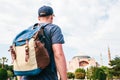 A traveling man with a backpack in Sultanahmet Square near the famous Aya Sofia mosque in Istanbul in Turkey. Travel Royalty Free Stock Photo