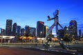 The Traveling Man is part of a three steel sculpture series at Elm Street DART Station in Dallas Royalty Free Stock Photo