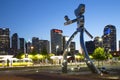 The traveling man and skyline of Dallas at night