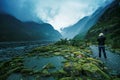 Traveling man take a photograph in franz josef glacier important traveler destination in south island new zealand