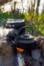 Camping and tourist equipment. For breakfast and dinner on a hike. Cooking food at the stake. Crockery in the campaign. Meal at th Royalty Free Stock Photo