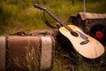 Traveling musician kit, Guitar, suitcase Royalty Free Stock Photo