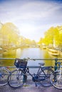 Traveling In the Netherlands. City of Amsterdam. Traditional Dutch Bicycles In Front of Amsterdam Canal