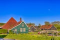 Traveling Through The Netherlands. Traditional Dutch Village with Wooden Bridge and Canal in Zaanse Schans in Holland, The