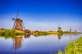 Traveling Through The Netherlands. View of Traditional Romantic Dutch Windmills in Kinderdijk Village Royalty Free Stock Photo