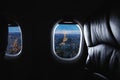 Traveling Paris, France famous landmark and travel destination in Europe. Aerial view Eiffel Tower through airplane window