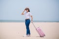 Traveling people concept. Young happy asian gril at the beach