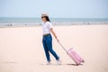 Traveling people concept. Young happy asian gril at the beach