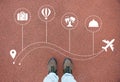 Traveling plane icons with solo traveler shoes closeup