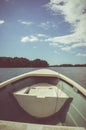 Traveling in the river with small boat, summer day. Vignette and