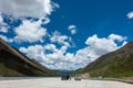 Visitors on 318 highway in Tibet under Blue sky white cloud Royalty Free Stock Photo