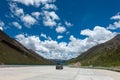 Visitors on 318 highway in Tibet under Blue sky white cloud Royalty Free Stock Photo