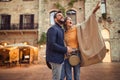 Traveling couple tourists walking around old town Royalty Free Stock Photo