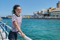 Traveling teenager girl on sea bay Mirabello enjoys beauty nature Royalty Free Stock Photo