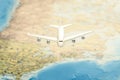 Traveling, tourism, communications and all things related series - plane over world map. Filtered image: cross processed vintage e Royalty Free Stock Photo