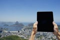 Traveling Tourist Holding Tablet at Rio de Janeiro Brazil Skyline