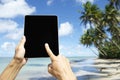 Traveling Tourist Using Tablet at Beach in Nordeste Bahia Brazil