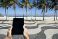 Traveling Tourist Using Tablet Copacabana Rio de Janeiro Brazil