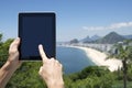 Traveling Tourist Using Tablet at Rio de Janeiro Brazil Beach