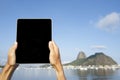Traveling Tourist Using Tablet at Sugarloaf Rio de Janeiro Brazil