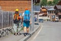 Traveling tourists with backpacks in Mestia, Svaneti, Georgia