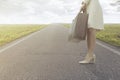 Traveling woman waits with her suitcase to leave for a new journey