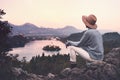 Traveling young woman looking at Bled Lake, Slovenia, Europe