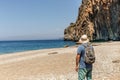 Traveller with backpack at the beach. Royalty Free Stock Photo