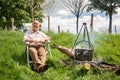 Traveller cooking food on an open fire at Appleby Horse Fair