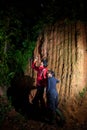 Traveller couple search and explore through tropical rain forest Royalty Free Stock Photo